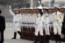 Members of the People's Liberation Army's navy guard of honour prepare to use a string to ensure that soldiers stand in a straight line in Beijing