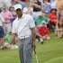 Tiger Woods gestures as his putt misses the cup in the ninth green during the third round of The Players championship golf tournament at TPC Sawgrass, Saturday, May 11, 2013 in Ponte Vedra Beach, Fla. (AP Photo/Gerald Herbert)