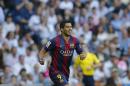 CORRECTING PLAYER WHO SCORED TO NEYMAR - Barcelona's Luis Suarez, celebrates after Barcelona teammate Neymar scored during a Spanish La Liga soccer match between Real Madrid and Barcelona at the Santiago Bernabeu stadium in Madrid, Spain, Saturday Oct. 25, 2014. (AP Photo/Paul White)