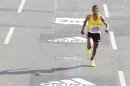 Ethiopia's marathon runner Gebrselassie arrives at the finish line to set a new world record at the 35th Berlin marathon in Berlin
