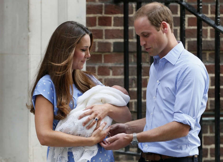 Britain's Prince William and his wife Catherine, Duchess of Cambridge appear with their baby son, as they stand outside the Lindo Wing of St Mary's Hospital, in central London
