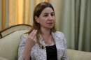 Iraq's only Yazidi member of parliament, Vian Dakhil, answers journalists' questions during an interview on September 20, 2014 in Arbil, Iraq