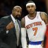 New York Knicks head coach Mike Woodson talks to Carmelo Anthony, right, during the first half of an NBA basketball game against the Toronto Raptors, Wednesday, Feb. 13, 2013, in New York. (AP Photo/Frank Franklin II)