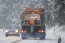 A snow plough clears a regional road near Koenigsfeld in the Black Forrest in southern Germany