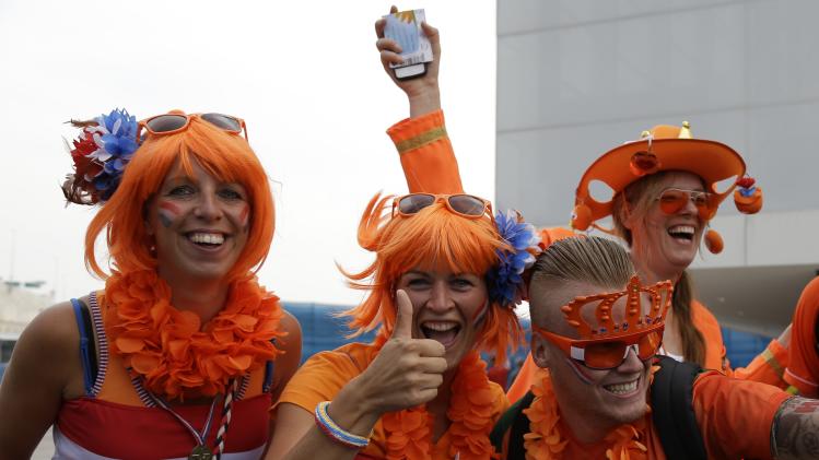 Dutch fans cheers for their national before the group B World Cup soccer match between the Netherlands and Chile at the Itaquerao Stadium in Sao Paulo, Brazil, Monday, June 23, 2014. (AP Photo/Thanassis Stavrakis)