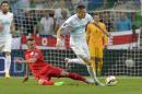England Jack Wilshere (L) fights for the ball against Slovenia's Josip Ilicic during a Euro 2016 qualifying football match at the Stozice stadium in Ljubljana on June 14, 2015