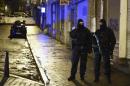 Police stand guard in Verviers on January 15, 2015, after two men were reportedly killed during an anti-terrorist operation