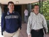 San Francisco 49ers coach Jim Harbaugh, left, walks with his brother John Harbaugh, coach of the Baltimore Ravens, at the NFL football annual meetings Tuesday, March 19, 2013, in Phoenix. (AP Photo/Ross D. Franklin)