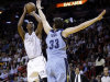 Miami Heat's Chris Bosh (1) prepares to shoot against Memphis Grizzlies' Marc Gasol (33) in the first half of an NBA basketball  game in Miami, Friday, March 1, 2013. (AP Photo/Alan Diaz)