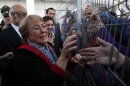 Former Chilean president and former executive director of gender equality body U.N. Women Michelle Bachelet is welcomed by her supporters upon her arrival at Santiago airport