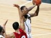 Michigan State's Keith Appling, right, shoots against Wisconsin's Traevon Jackson (12) during the first half of an NCAA college basketball game, Thursday, March 7, 2013, in East Lansing, Mich. (AP Photo/Al Goldis)