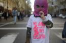 A girl wears a t-shirt reading "Neither mistress nor slave" as she takes part in a demonstration against femicide in Buenos Aires on June 3, 2015