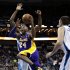 Los Angeles Lakers guard Kobe Bryant (24) drives to the basket past New Orleans Hornets forward Al-Farouq Aminu, behind, during the first half of an NBA basketball game in New Orleans, Wednesday, March 6, 2013. (AP Photo/Gerald Herbert)