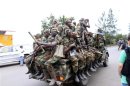 Congolese Revolution Army rebels sit in a truck as they patrol a street in Goma in the eastern Democratic Republic of Congo, soon after the rebels captured the city from the government army