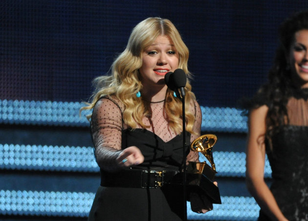 Kelly Clarkson accepts the award for best pop vocal album for "Stronger" at the 55th annual Grammy Awards on Sunday, Feb. 10, 2013, in Los Angeles. (Photo by John Shearer/Invision/AP)