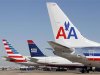 The tail sections of a newly designed American Airlines aircraft, a US Airways aircraft and a traditional American Airlines aircraft are lined up at at Dallas-Ft Worth International Airport