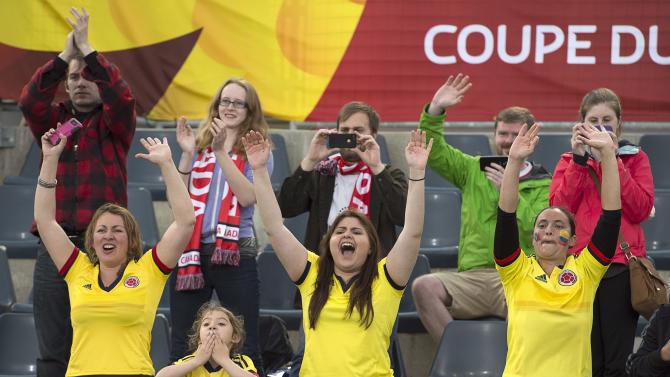 Colombia fans cheer after they played Mexico to a 1-1 draw in a FIFA Women&#39;s World Cup soccer match in Moncton, New Brunswick, Canada, Tuesday, June 9, 2015. (Andrew Vaughan/The Canadian Press via AP) MANDATORY CREDIT