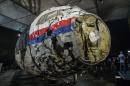 Reconstructed wreckage of the MH17 airplane is seen after the presentation of the final report into the crash of July 2014 of Malaysia Airlines flight MH17 over Ukraine, in Gilze Rijen, the Netherlands
