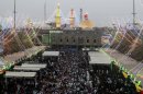 Shiite pilgrims gather in front of Imam Abbas shrine for a major religious festival in Karbala, 50 miles (80 kilometers) south of Baghdad, Iraq, Thursday, July 5, 2012. The Shabaniyah festival marks the birth of Mohammed al-Mahdi, the 12th Shiite imam who disappeared in the 9th century. (AP Photo/Hadi Mizban)
