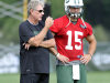 FILE - In this July 27, 2012, file photo, New York Jets special teams coordinator Mike Westhoff, left, talks with quarterback Tim Tebow on opening day of their NFL football training camp in Cortland, N.Y. Westhoff, the Jets' recently retired special teams coordinator, told a Florida radio station that the way the team handled Tim Tebow was "an absolute mess." (AP Photo/Bill Kostroun, File)