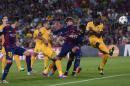 Barcelona's Gerard Pique, 2nd from right, scores with a header against APOEL during the Champions League Group F soccer match between Barcelona and Apoel at the Camp Nou stadium in Barcelona, Spain, Wednesday, Sept. 17, 2014. (AP Photo/Manu Fernandez)