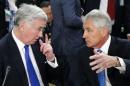 Britain's Defence Secretary Fallon talks to U.S. Secretary of Defense Hagel during a NATO defence ministers meeting in Brussels