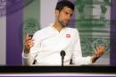 Novak Djokovic of Serbia gestures during a press conference, after being defeated by Sam Querrey of the U.S in their men's singles match on day six of the Wimbledon Tennis Championships in London, Saturday, July 2, 2016. (Joe Toth/Pool Photo via AP)