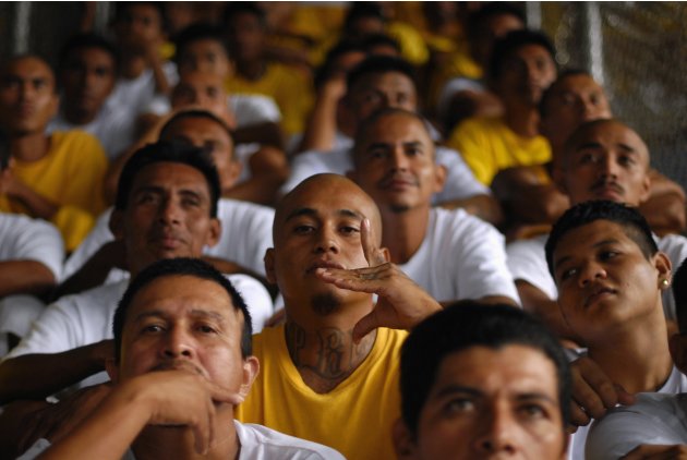 A gang member flashes his gang&#39;s sign during a mass at the prison of Izalco, about 65 km (40 miles) from San Salvador