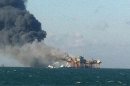 In this image released by a oil field worker and obtained by the Associated Press, a fire burns on a Gulf oil platform Friday, Nov. 16, 2012, after an explosion on the rig, in the Gulf of Mexico off the Louisiana coast. An explosion and fire ripped through a Gulf oil platform Friday as workers used a cutting torch, sending at least four people to a hospital with burns and leaving two missing in waters off Louisiana. (AP Photo)