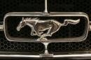The logo of a vintage Ford Mustang is pictured at the Essen motor show