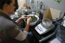 Danielle Hackett prepares marijuana buds for sale at BotanaCare in Northglenn, Colorado