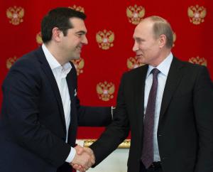 Greek Prime Minister Alexis Tsipras (L) shakes hands …