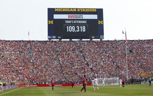 The scoreboard announces attendance of 109,318 during a friendly between Real Madrid and Manchester United. (AP Photo)