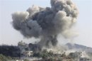 Smoke rises after what activists said was shelling by forces loyal to Syria's President al-Assad in the village of Douri