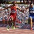 United States' Ashton Eaton, left, and Ukraine's Voleksiy Kasyanov, right, cross the finish line in a men's decathlon 100-meter heat during the athletics in the Olympic Stadium at the 2012 Summer Olympics, London, Wednesday, Aug. 8, 2012. (AP Photo/Anja Niedringhaus)
