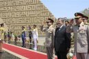 Egypt's President Mursi visits the tomb of ex-President al-Sadat and the Tomb of the Unknown Soldier during the commemoration of Sinai Liberation Day in Cairo