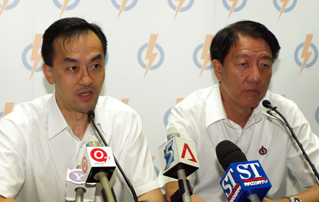 A sombre Dr Koh and DPM Teo at the PAP post election press conference
