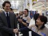 Fiat Chairman John Elkann shakes the hands of employees during the Maserati new opening plant in Turin