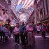 FILE - In this Thursday, March 22, 2012 file photo, tourists stop to watch the canopy light show at the Fremont Street Experience in Las Vegas. Despite some recent diversification, Nevada's economy is more concentrated than virtually any other state. The tourism/gambling sector accounts for more than one-quarter of Nevada's 1.14 million non-farm jobs, and 13 of the 20 largest employers are casino/hotel companies. President Barack Obama and his Republican rival, Mitt Romney, have visited the state, competing strenuously for Nevada's six electoral votes in what has become one of the most intense swing-state contests. (AP Photo/Julie Jacobson, File)