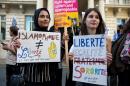 Women join a demonstration outside the French Embassy in London on August 26, 2016