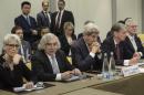U.S. Secretary of State John Kerry, center, and British Foreign Secretary Philip Hammond, second right, waits with U.S. Under Secretary for Political Affairs Wendy Sherman, left, U.S. Secretary of Energy Ernest Moniz, second left, and others before a meeting with Russia, China, France, Germany, European Union and Iranian officials at the Beau Rivage Palace Hotel in Lausanne, Switzerland Monday, March 30, 2015, during Iran nuclear talks. Negotiations over Iran's nuclear program are entering a critical phase with differences still remaining just two days before a deadline for the outline of an agreement. (AP Photo/Brendan Smialowski, Pool)
