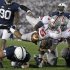 Ohio State quarterback Braxton Miller (5) dives over Penn State linebacker Glenn Carson (40) for a third-quarter touchdown during an NCAA college football game in State College, Pa., Saturday, Oct. 27, 2012. (AP Photo/Gene J. Puskar)