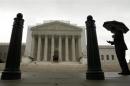 A man holds an umbrella outside the U..S. Supreme Court in Washington