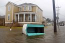 A porta-potty is seen floating on a flooded street as Hurricane Isaac passes through New Orleans, Louisiana