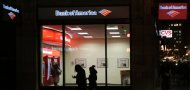 <p>               In this Thursday, Dec. 13, 2012 photo people use a Bank of America ATM in Boston. Bank of America says its fourth-quarter earnings shrank as it cleaned up old problems from its mortgage unit.  The bank made $367 million in the last three months of 2012, down from $1.6 billion in the same period a year ago. The earnings were equivalent to 3 cents per share.  (AP Photo/Charles Krupa)
