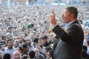 Egypt's President Mohamed Mursi speaks to supporters in front of the presidential palace in Cairo