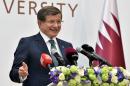 Turkish Prime Minister Ahmet Davutoglu addressing an audience during a seminar at the university in the Qatari capital, Doha, on April 28, 2016