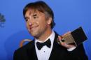 Director Richard Linklater poses backstage with his award for Best Director - Motion Picture for "Boyhood" at the 72nd Golden Globe Awards in Beverly Hills