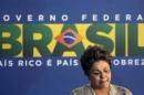 Brazil's President Dilma Rousseff reacts during the signing ceremony of the Rio de Janeiro's international airport concession in Rio de Janeiro