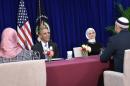 US President Barack Obama participates in a roundtable discussion with members of the Muslim community while visiting the Islamic Society of Baltimore on February 3, 2016 in Windsor Mill, Maryland